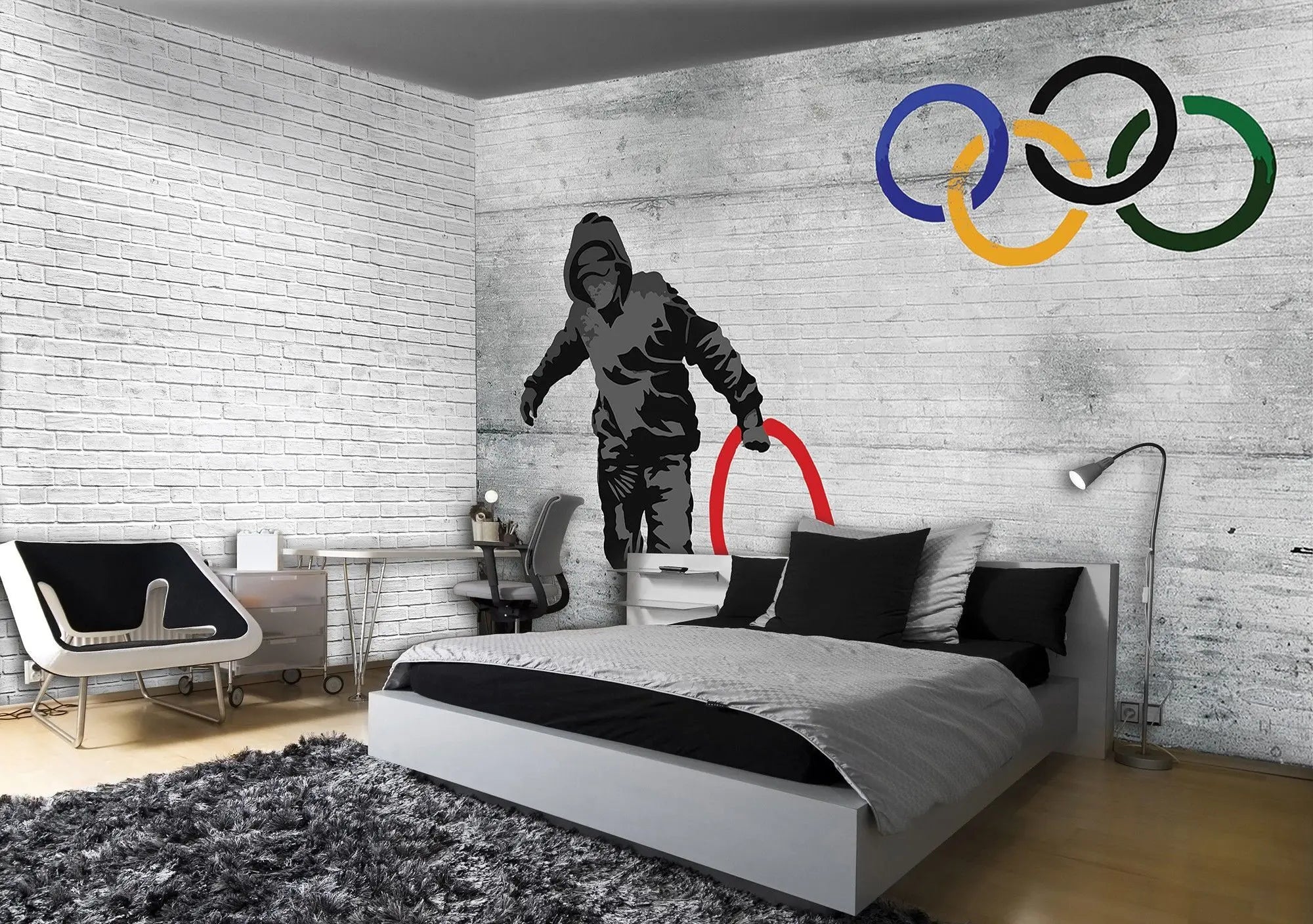 Billede 2 af Fototapet - Dreng i hættetrøje med rød ring foran olympiske ringe på grå mur